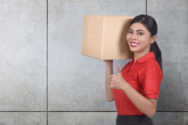 Smiling asian courier woman bring the parcel 