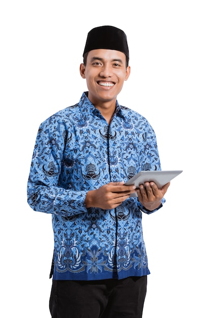 Smiling asian man wearing a blue traditional shirt