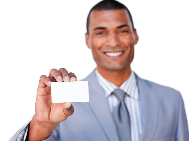 Smiling attractive businessman holding a white card 