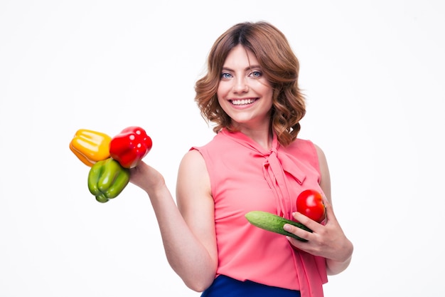 Smiling attractive woman holding vegetables