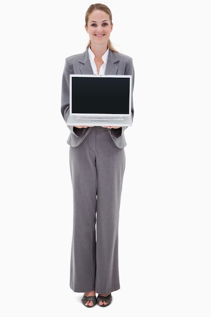 Smiling bank employee presenting her laptop