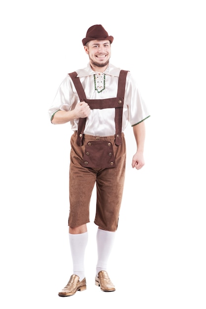 Smiling bavarian man in shirt and leather pants