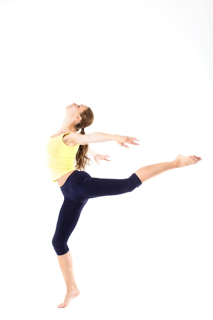 Smiling beautiful woman jumping isolated on white background Fitness and healthy lifestyle