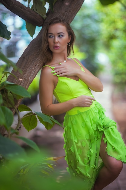 Smiling beauty in garden looking at camera