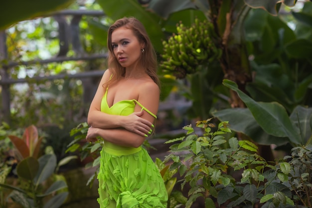 Smiling beauty in garden looking at camera