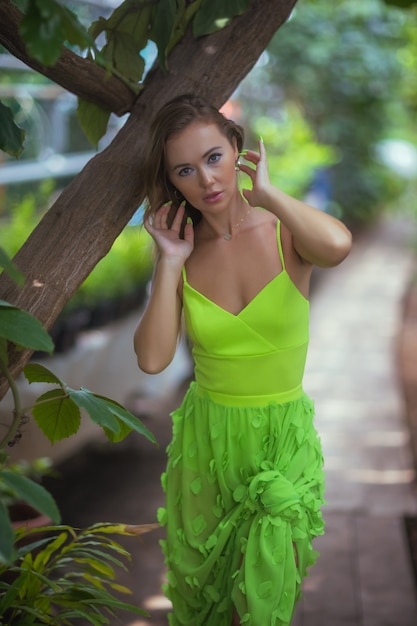 Smiling beauty in garden looking at camera