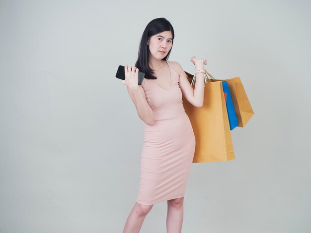 Smiling beauty woman with colorful shopping bags