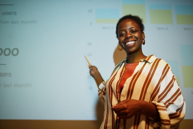 Smiling black businesswoman presenting