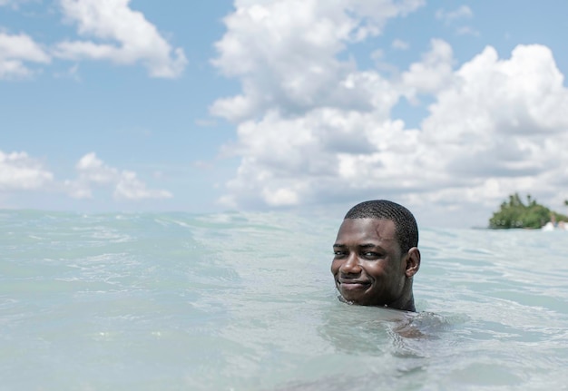 Smiling black man in the sea