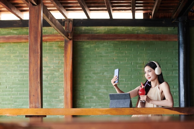 Smiling Blogger Taking Selfie