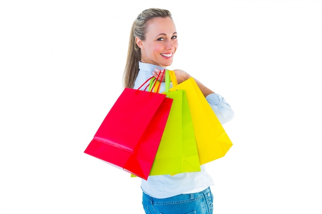 Smiling blonde holding shopping bags