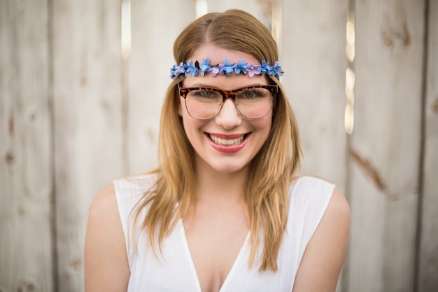 Smiling blonde woman wearing glasses and headband 