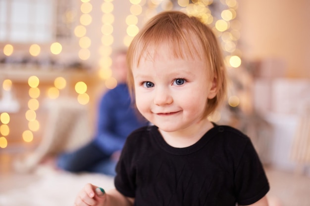 Smiling boy looking to the camera Christmas background