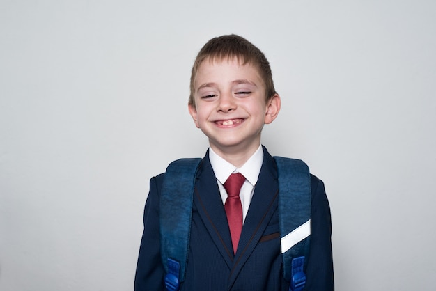 Smiling Boy in school uniform on white background. Middle School, Junior High School. Children education.