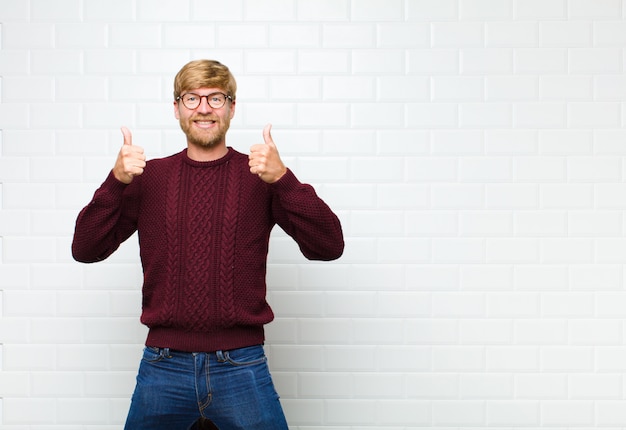 smiling broadly looking happy, positive, confident and successful, with both thumbs up