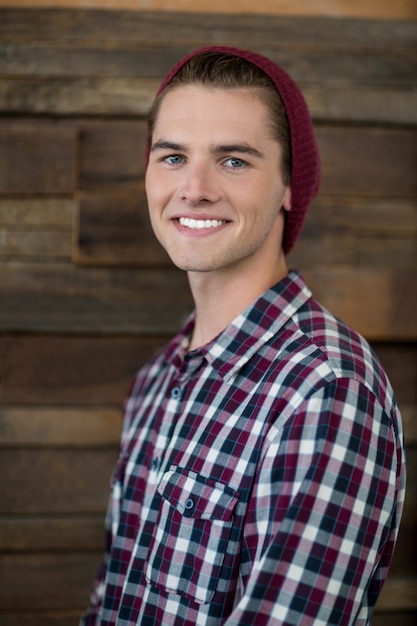 Smiling business executive standing in office