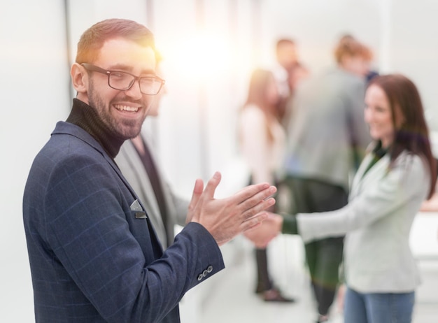 smiling business man standing in the hall of the business center. photo with copy space