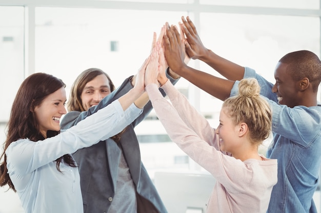 Photo smiling business team giving high five