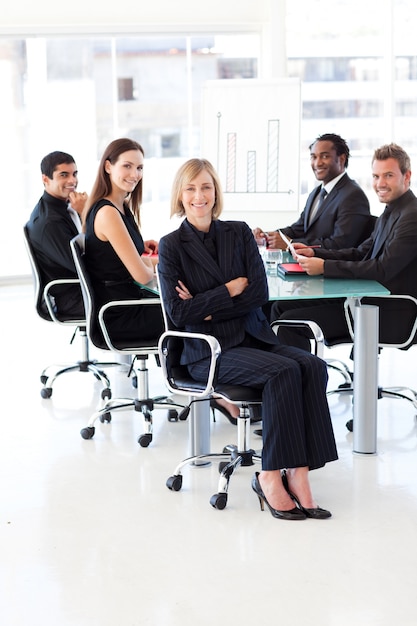 Smiling business team sitting in a presentation