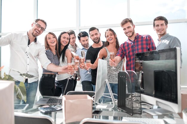 Smiling business team standing in new office