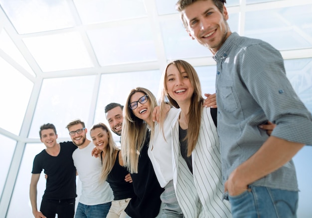 Smiling business team standing in the new officebusiness concept