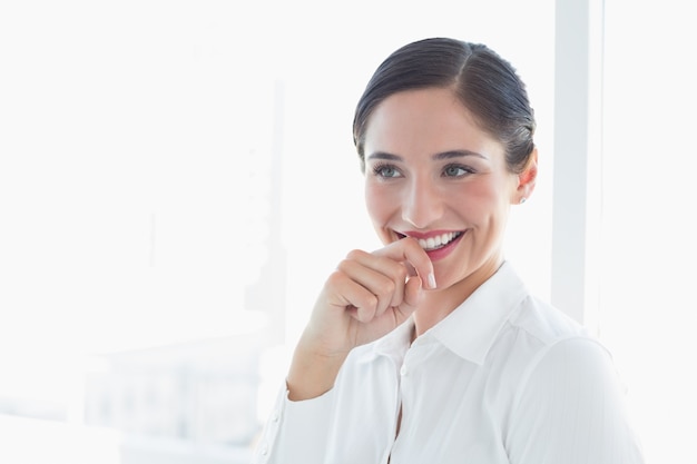 Smiling business woman looking away