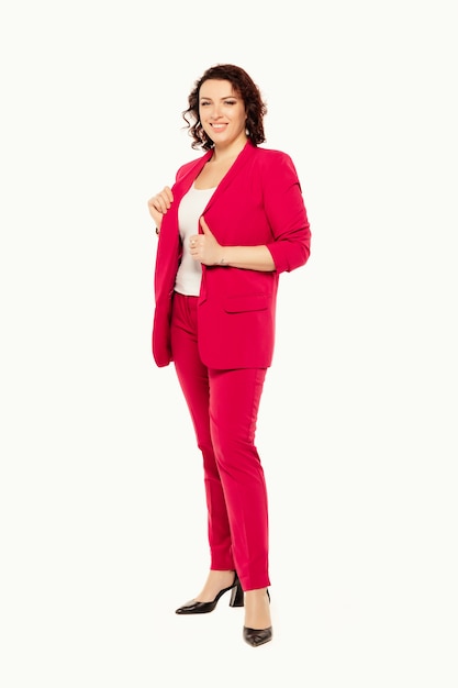 Smiling business woman in pink suit