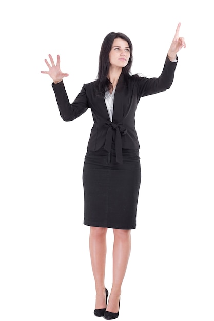 Smiling business woman pointing on a virtual item.