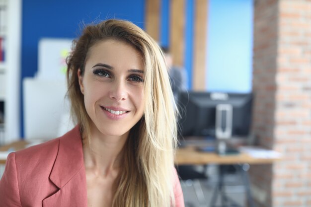 Smiling business woman standing in office