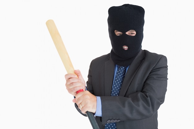 Smiling businessman dressing like a burglar