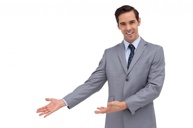 Smiling businessman giving a presentation with his hands