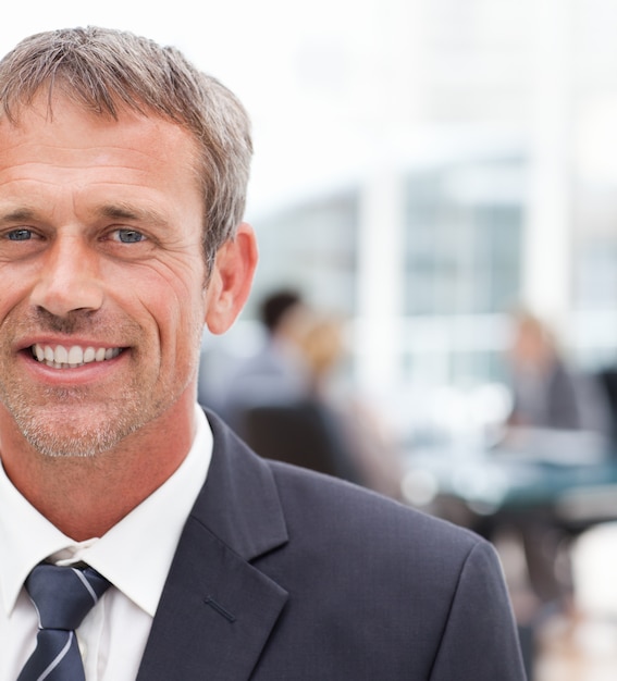 Smiling businessman in his office