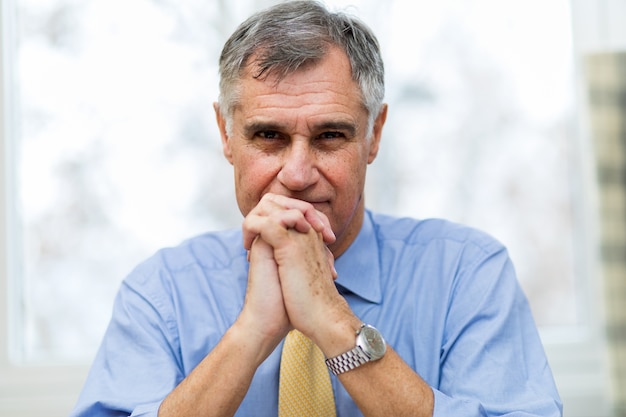 Smiling businessman in his office