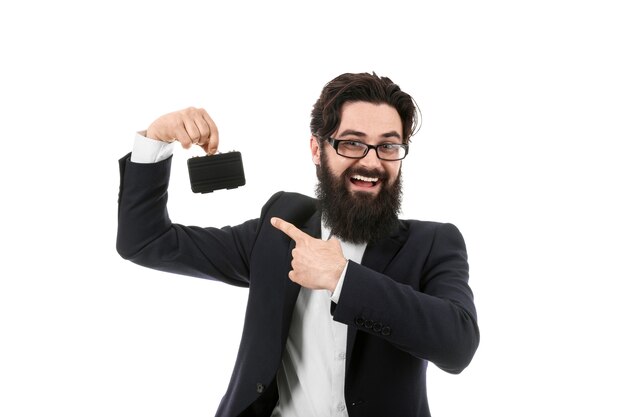 Smiling businessman holding an mini briefcase, isolated on white background, small business concept