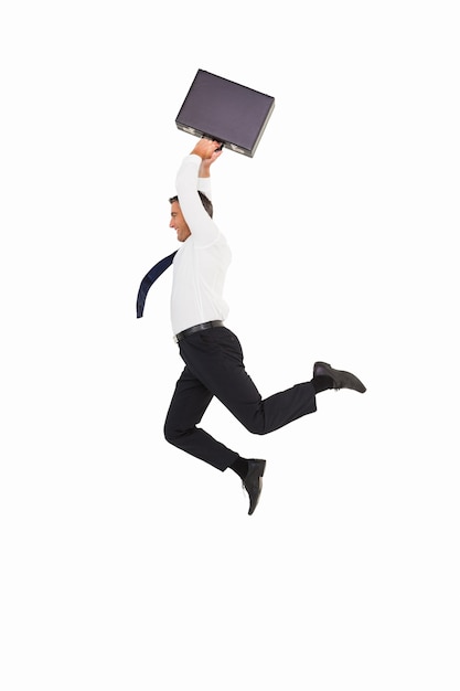 Photo smiling businessman leaping while briefcase