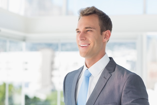 Smiling businessman looking away