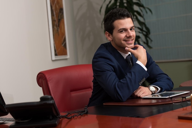 Smiling Businessman Looking At Camera With Reliability