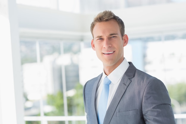 Smiling businessman looking at camera