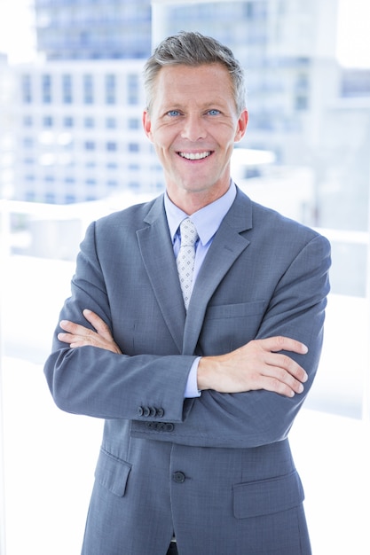 Smiling businessman looking at camera