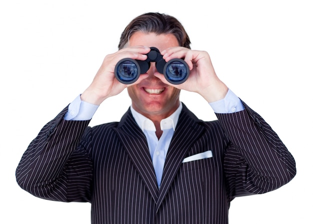 smiling businessman using binoculars