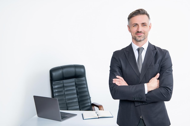 Smiling businessman wear suit in boss office on white background