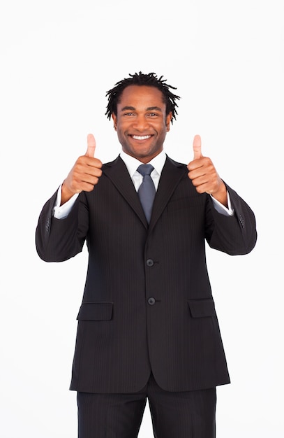 Smiling businessman with thumbs up