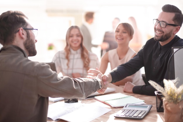 Smiling businessman at a working meeting in the office