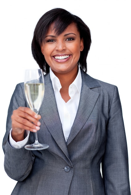 Smiling businesswoman celebrating a success with Champagne