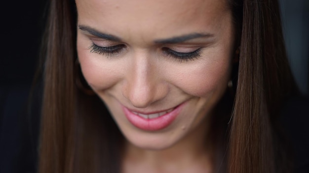 Smiling businesswoman face portrait Closeup female entrepreneur looking down