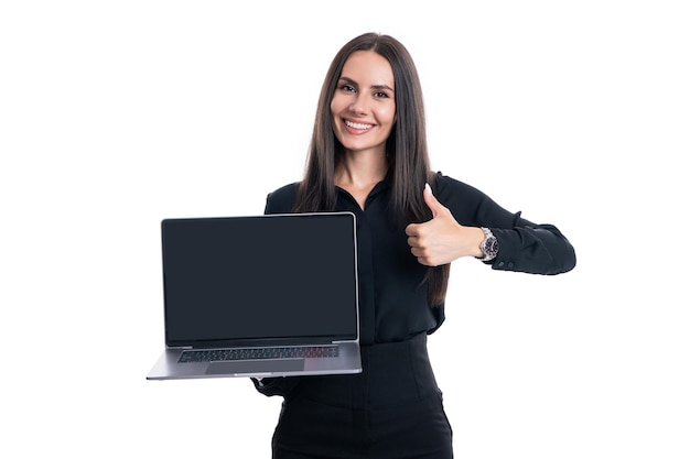 Smiling businesswoman freelancer ceo boss manager holding open laptop with blank screen mockup for business advertisement giving thumbsup gesture studio isolated on white copy space