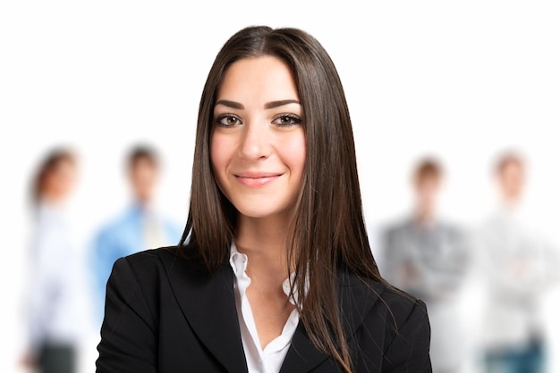 Smiling businesswoman in front of a business team