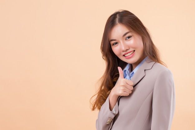 smiling businesswoman giving thumb up