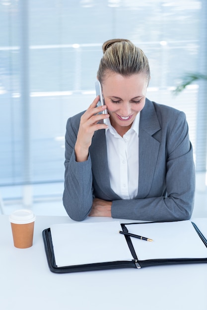 Smiling businesswoman having phone call