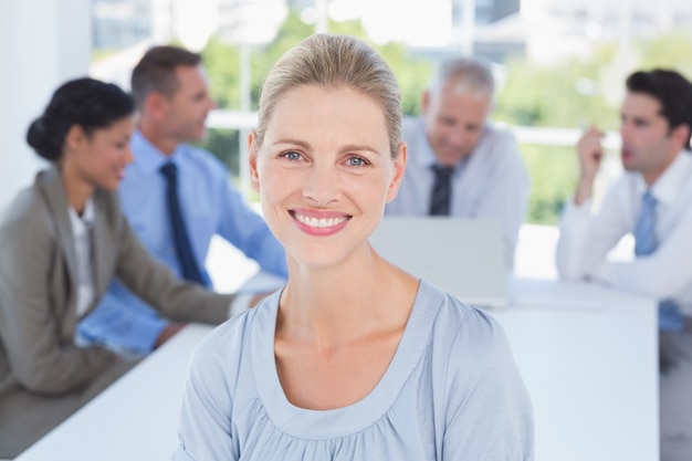 Smiling businesswoman and her team